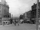 General view of Haymarket from Fitzalan Square, Nos. 2 and 4 Yorkshire Penny Bank, No. 8 and 10 True Form Boot Co. and Norfolk Market Hall in distance, right, Fifty Shilling Tailor, left
