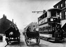 View: s00076 Short ended tram No. 142 in Attercliffe Road with Corporation horse drawn dustcart and J.C. and J. Bannister's (butcher, Nos 101 and 103 Gower Street) butcher horse and cart