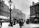 General view of Moorhead looking towards Pinstone Street, including ice cream vendor and drinking fountain, right. T. and G. Roberts, drapers, left