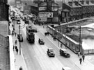 Elevated view of The Moor looking towards junction with Prince Street. Temporary window display belonging to John Atkinson, right
