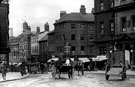 View: s00231 Market Place and Angel Street. Premises on right include No. 20 Angel Street, Charles J. Muddiman, bootmaker (corner of King Street) and Fitzalan Market Hall
