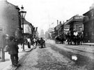South Street, Moor, at junction with Earl Street, right. Premises include Nos. 65 - 67 John Eaton, pawnbrokers, No. 75 Francis Redshaw, grocer (with flag advertising tea), No 79, Pump Tavern. St Paul's Church in background