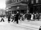 View: s00318 High Street from Fargate. Policeman directing pedestrians. No. 2 Barclays Bank Ltd., Nos. 4 - 6 Boots Chemist