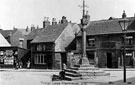 Woodhouse Market Cross, Market Square/Market Place, Woodhouse. No 14, Market Square, Cross Daggers public house, right (date over doorway of pub is 1658). The cross was erected in 1775 by Joshua Littlewood. A sun dial and weather vane were added in 1