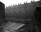 Rear of terraced houses, Nos. 3 - 31 Cromford Street and weir on River Sheaf