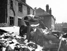 Huntingdon Crescent - damaged car in a garden, air raid damage