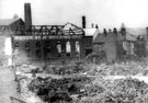 Forncett Street showing air raid damage to Motor Body Building Co. Ltd.