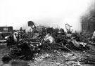 Debris in High Street - burnt out tram, after air raids, World War II