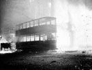 View: s01156 Trams on fire outside King's Head Hotel, High Street, during air raid