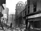 Change Alley, showing air raid damage, King's Head Hotel on right