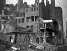 Site of E. Weston and Co., newsagents, Change Alley, showing air raid damage