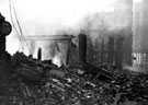 Site of E. Weston and Co., newsagents, Change Alley, showing air raid damage