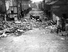 Lifting an unexploded bomb in Devonshire Street, air raid damage