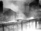 Burning factory, air raid damage (location unknown)