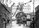 View: s01546 Queen Victoria's visit to Sheffield, decorative arch at junction of Broad Street and South Street, Park, photographed from South Street looking towards Broad Street, premises in background include Broad Street Cafe