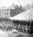 View: s01572 Queen Victoria's visit, Town Hall Square, military band. No. 70 Charles A. George, chemist, in background