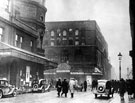 Shell of The Theatre Royal, Tudor Street at junction of Arundel Street, after the fire which destroyed it. Built in 1773 on the site of The Assembly Rooms. Greatly enlarged in 1880 and in 1898 partly reconstructed. Lyceum Theatre, left