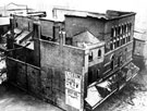 Shell of The Theatre Royal, Tudor Street at junction of Arundel Street, after the fire which destroyed it. Built in 1773 on the site of The Assembly Rooms. Greatly enlarged in 1880 and in 1898 partly reconstructed. Destroyed by fire December 1935