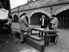 View: s01695 Sheffield Canal Basin. Officials discussing plans in the boat yard of the Canal Basin showing (l. to r.) David Philips, Russell Cooper, Gerald Smith and Dave Tulley