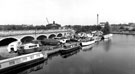 Sheffield Canal Basin showing water transport including 'Elizabeth Edwards' with old railway viaduct and Sheaf Works in the background