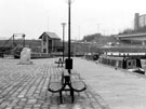 Victoria Quays, Sheffield Canal Basin showing the Heron and Fish sculpture by Vega Bermejo, Supertram Bridge and Hyde Park Flats (right)
