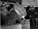 Workmen casting a mould at George Oxley's Iron Foundry.