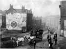 Reuben Thompson's coach in Surrey Street. Prior to construction of Town Hall, left. Jubilee Monolith can be seen in background