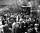 Laying of record stone on the partially constructed Howden Dam by Thomas Gainsford, Chairman of the Derwent Valley Water Board, Steam Crane in background