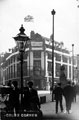 View: s03239 Cole Brothers, corner of Fargate and Church Street, decorated for royal visit of King Edward VII and Queen Alexandra, photographed from High Street