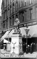 View: s03258 Royal visit of King Edward VII and Queen Alexandra, High Street, decorative lion outside Nos. 10 - 16 William Foster and Son Ltd., tailors, Foster's Buildings