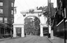 Decorative arch, Commercial Street, to celebrate the royal visit of King Edward VII and Queen Alexandra