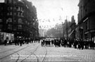 High Street decorated for royal visit of Prince and Princess of Wales (later became King George V and Queen Mary), Marples Hotel, left, Fitzalan Market Hall, right