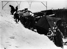 Troops digging out train during World War II