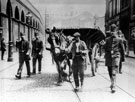A carter with a police escort during the Coal Strike with Police Sgt Joe Hurst on the right
