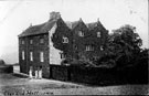 Lees Hall, three maids outside kitchen door, before 1893