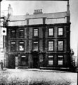 Broadbent House, also known as 'The Old Banker's House', No. 3 Hartshead, Figtree Lane, right, St. Peter's Close under arch, at the time of this picture it was being used by Fowler and Marshall, Land Agents and Surveyors