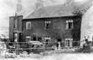 Flood damage at cottages off Owlergreave Road, Darnall showing No. 107 Mrs Jane Smith, tobacconist and Davy Brothers Ltd., engineers. Car Brook ran alongside cottages (situated behind railings)