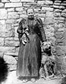 Sheffield Flood. Mrs. Kirk of Damflask with her dog and cat she returned to rescue