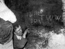 Initials and date cut deep into the rock walls of an old tunnel, discovered by workmen in 1935, below the offices of The Star newspaper at Hartshead. Explored by Frank Brindley who concluded that it was the missing tunnel to Sheffield Castle.
