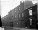 View: s09921 Wheatley Brothers, cutlery manufacturers, Eclipse Works, Nos. 53 - 55 Boston Street (formerly New George Street). No 51, Joseph Gray and Son, surgical instrument makers, Truss Works, left. Nos. 57 - 59 Talbot Hotel, right, Court No. 11 at rear