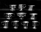 Silver bowls and cups by W. and G. Sissons