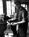 Edge tool manufacture, smithing scythe blades at Thomas Staniforth and Co. Ltd., sickle and reaping hook manufacturers, Severquick Works, Hackenthorpe