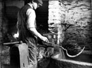 Edge tool manufacture, hardening a steel sickle at Thomas Staniforth and Co. Ltd., sickle and reaping hook manufacturers, Severquick Works, Hackenthorpe