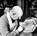 Harry Kugler engraving a silver dish at Atkin Brothers, silversmiths, Truro Works, Matilda Street