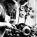 F. Whitham spinning with a burnish at Atkin Brothers, silversmiths, Truro Works, Matilda Street
