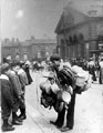 Basket seller, Haymarket, Norfolk Market Hall (prior to the rebuilding of the west front 1904-5) and Royal Hotel in background