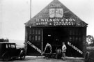 Horace Wilson and Son, motor and general engineers, Mosborough Moor, Mosborough. The building was formerly Moorhole Colliery Winding House. Horace Wilson (right) and Ernest, his son on left.