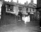 View: s11473 Rowland Street at junction with Apple Street, showing gable of No. 15, Rowland Street, where it adjoins the premises of Messrs. Longbottom and Co., Colliery Agents