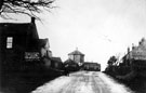 General view of Sheephill Road, Ringinglow Mission Church on left, Round House in distance