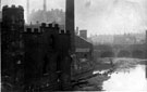 View: s12219 Scene on the River Don, No. 2 Wicker, Wicker Tilt also known as Huntsman's Forge, occupied by Benjamin Huntsman, tilter, and Wards, Blonk and Co., in foreground, Blonk Street Bridge and Tower Grinding Wheel in background